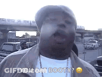 Man In Hat And White Shirt Says You Eat Booty GIF