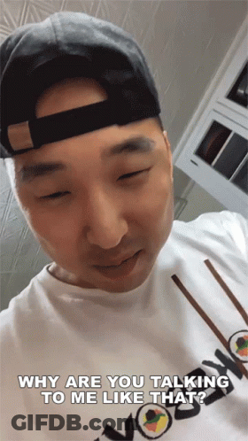 Man In Hat And White Shirt Talking GIF