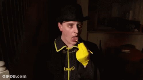 Man In Hat And Yellow Gloves Writing GIF