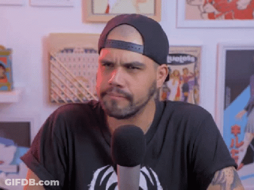 Man In Hat At Microphone Making Funny Face GIF
