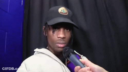 Man In Hat Being Interviewed GIF