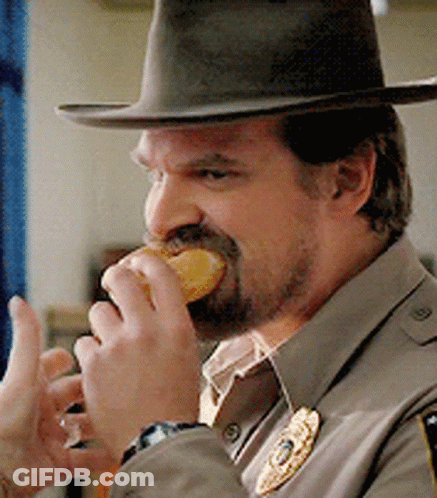 Man In Hat Eating Doughnut GIF