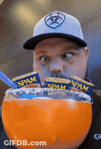 Man In Hat Eating Spam Cans GIF