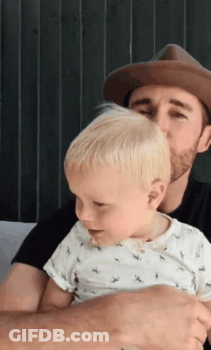 Man In Hat Holding Baby GIF