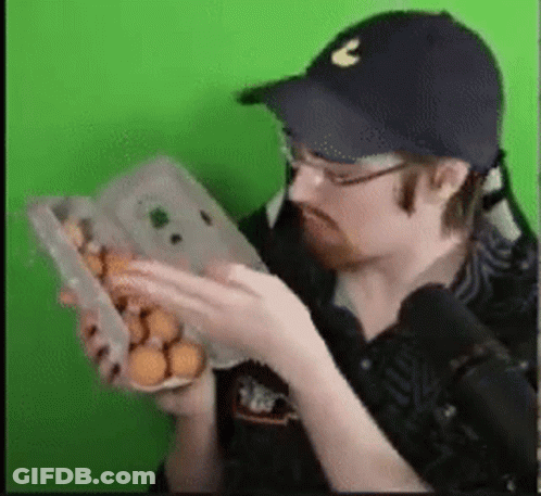 Man In Hat Holding Box Of Eggs GIF