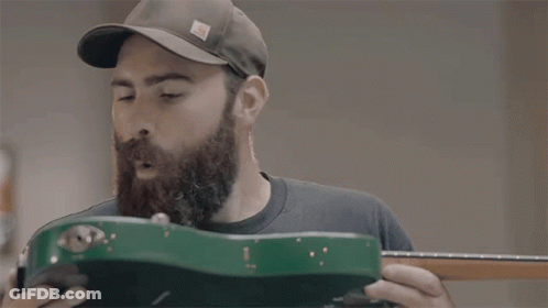 Man In Hat Holding Green Guitar GIF