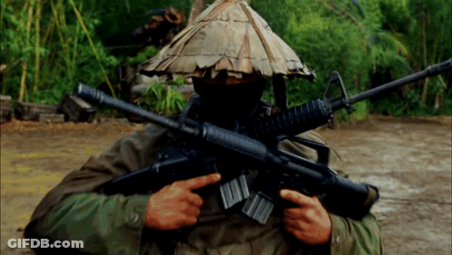 Man In Hat Holding Gun GIF