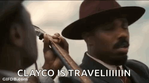 Man In Hat Holding Gun Near Another Man GIF