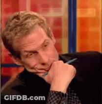 Man In Hat Holding Hammer In Workshop GIF