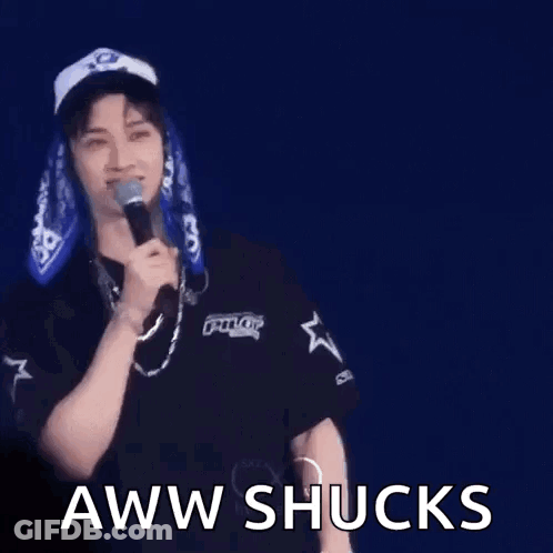 Man In Hat Holding Microphone Making Funny Face GIF