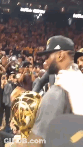 Man In Hat Holding Trophy GIF