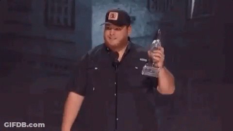 Man In Hat Holding Trophy Giving Middle Finger GIF
