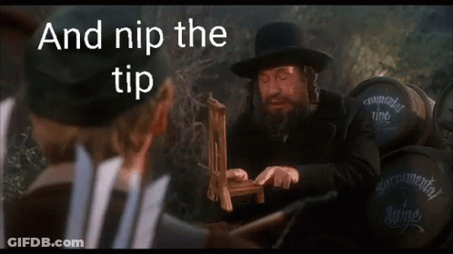 Man In Hat Holding Wooden Stick And Nip The Tip GIF