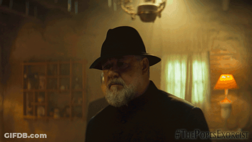 Man In Hat In Dark Room #ThePopesExorcist GIF