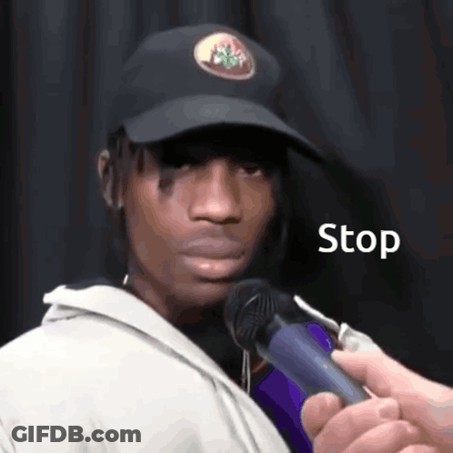 Man In Hat Interviewed With Stop Microphone GIF