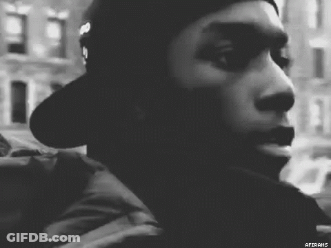 Man In Hat Looking At Camera GIF