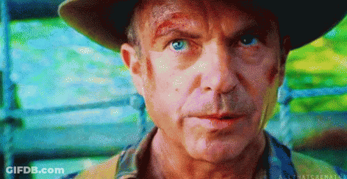 Man In Hat Looking At Camera GIF