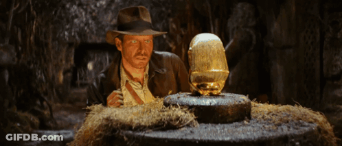 Man In Hat Looking At Statue GIF