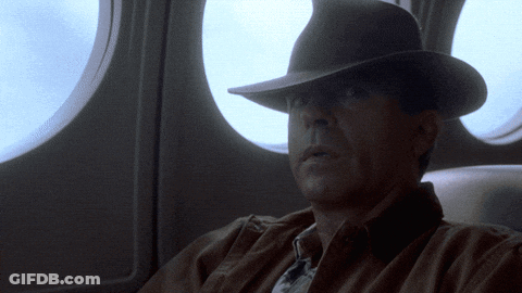 Man In Hat Looking Out Window GIF