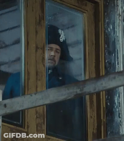Man In Hat Looking Out Window GIF