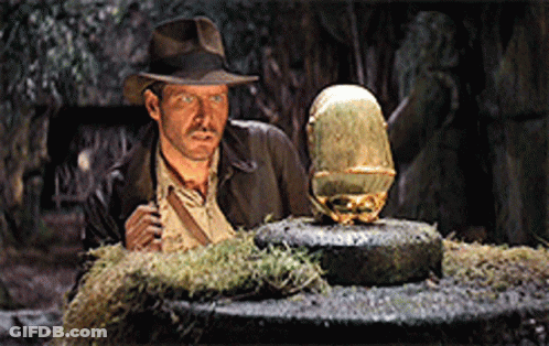 Man In Hat Next To Statue GIF