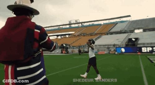 Man In Hat On Football Field Shedeur Sanders GIF