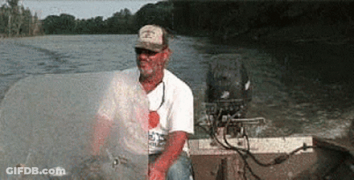 Man In Hat On Motorboat GIF