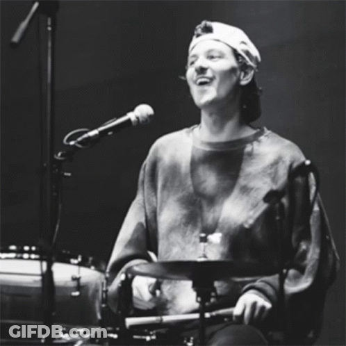 Man In Hat Playing Drums And Singing GIF