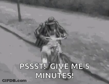 Man In Hat Riding Bicycle GIF
