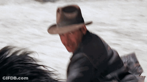 Man In Hat Riding Horse In Snow GIF