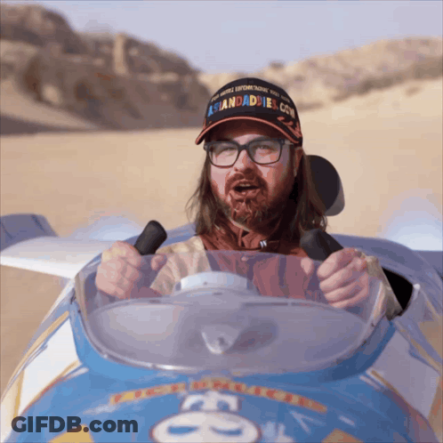 Man In Hat Saying Asiandaddies.com Driving Car GIF