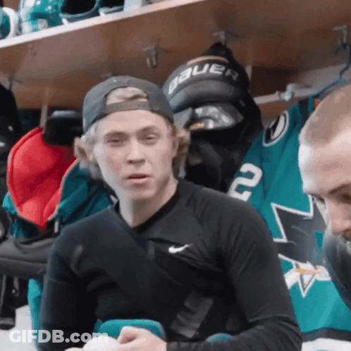 Man In Hat Saying Bauer Sitting In Locker Room GIF
