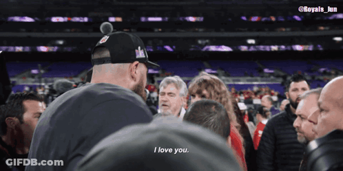 Man In Hat Saying I Love You To Crowd GIF