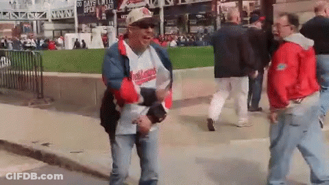 Man In Hat Saying Indians Walking Down Street GIF