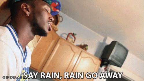 Man In Hat Saying Rain Rain Go Away GIF