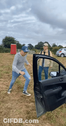 Man In Hat Saying SBS Standing Next To Car GIF