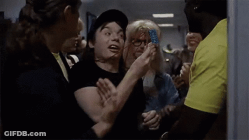 Man In Hat Saying Wayne's World Surrounded By People GIF