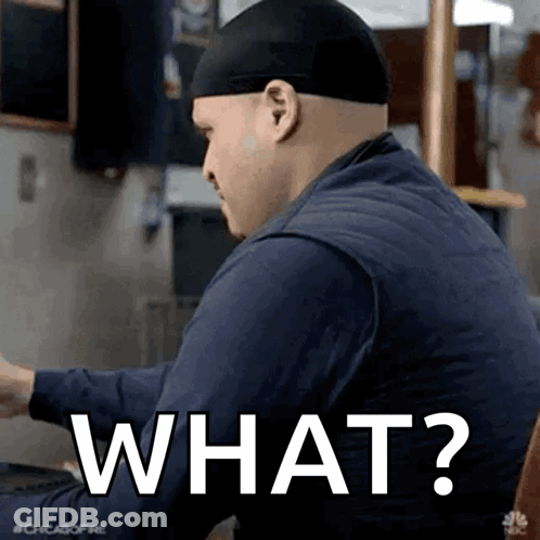 Man In Hat Saying What At Table GIF
