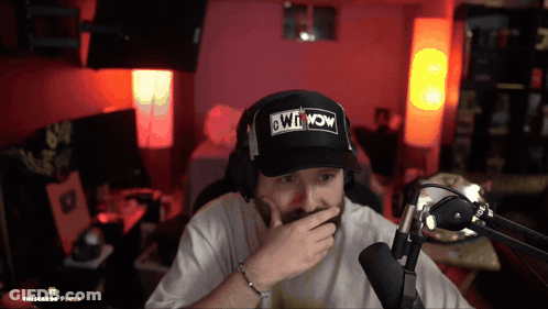 Man In Hat Saying Win Now Covering Mouth GIF