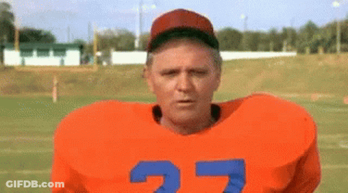 Man In Hat Saying You Can Do It In Crowd GIF