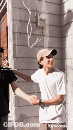 Man In Hat Shaking Hands With Man GIF