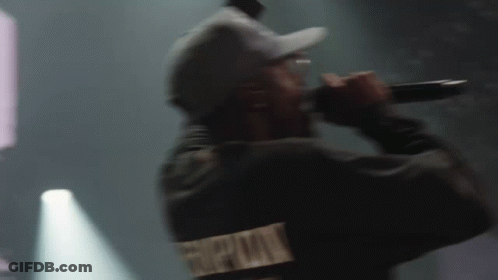 Man In Hat Singing Into Microphone GIF