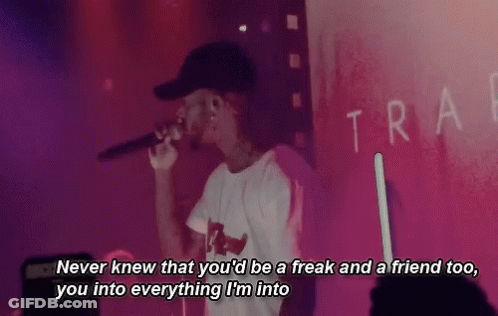 Man In Hat Singing Into Microphone On Stage GIF