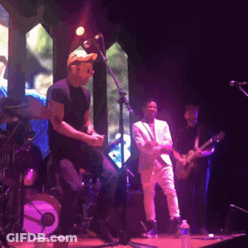 Man In Hat Singing Into Microphone GIF