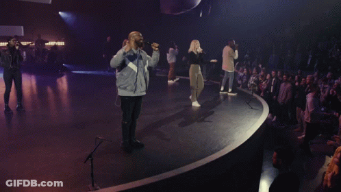 Man In Hat Singing Into Microphone GIF