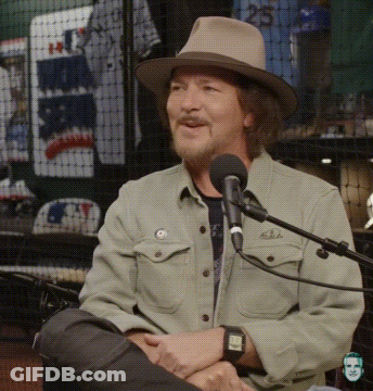 Man In Hat Sitting At Microphone GIF