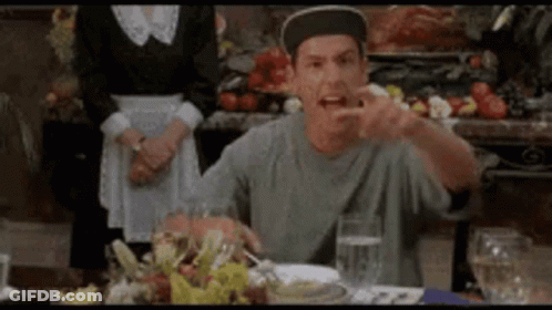 Man In Hat Sitting At Table With Water And Food GIF