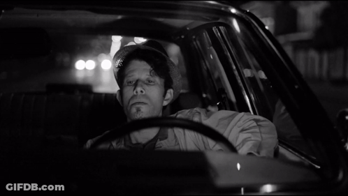 Man In Hat Sitting In Car At Night GIF