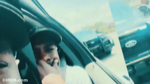 Man In Hat Sitting In Car With Ford Logo GIF