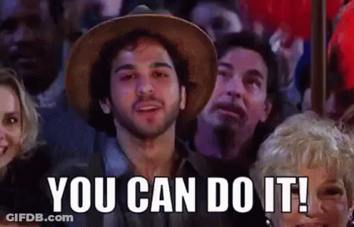 Man In Hat Sitting In Crowd Saying You Can Do It GIF
